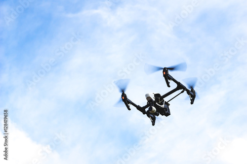 Modern quadcopter drone flying