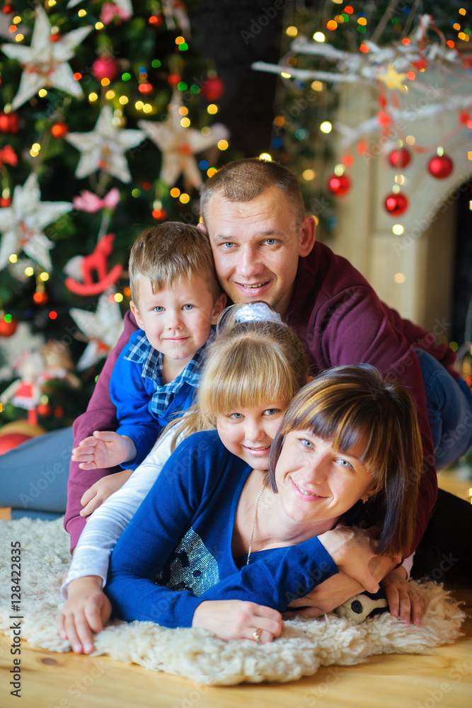 Happy family in festive studio. Happy family in festive studio.