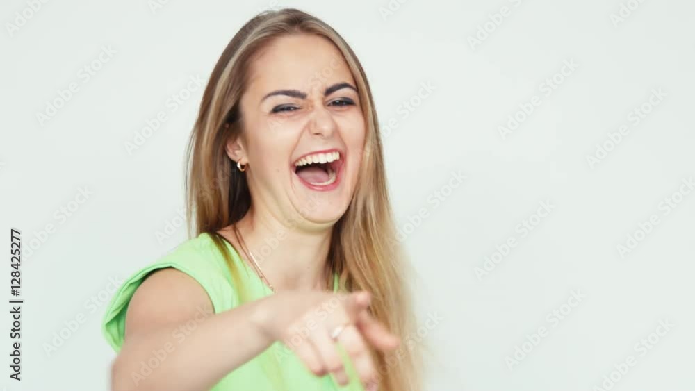 Teenager 18 years old laughing at camera on white background Teenager 18 years old laughing at camera on white background