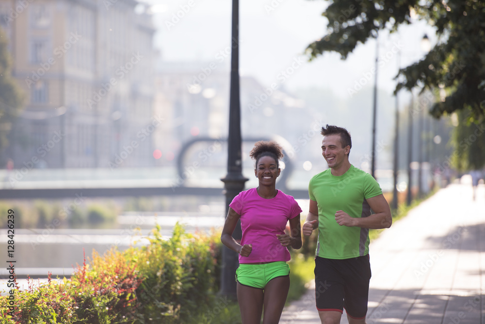 young multiethnic couple jogging in the city young multiethnic couple jogging in the city