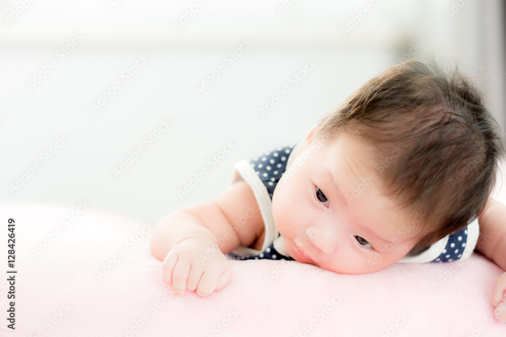 Portrait of adorable baby girl with copy space