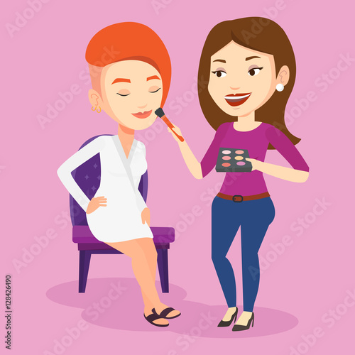 Visagiste doing makeup to young stylish girl.