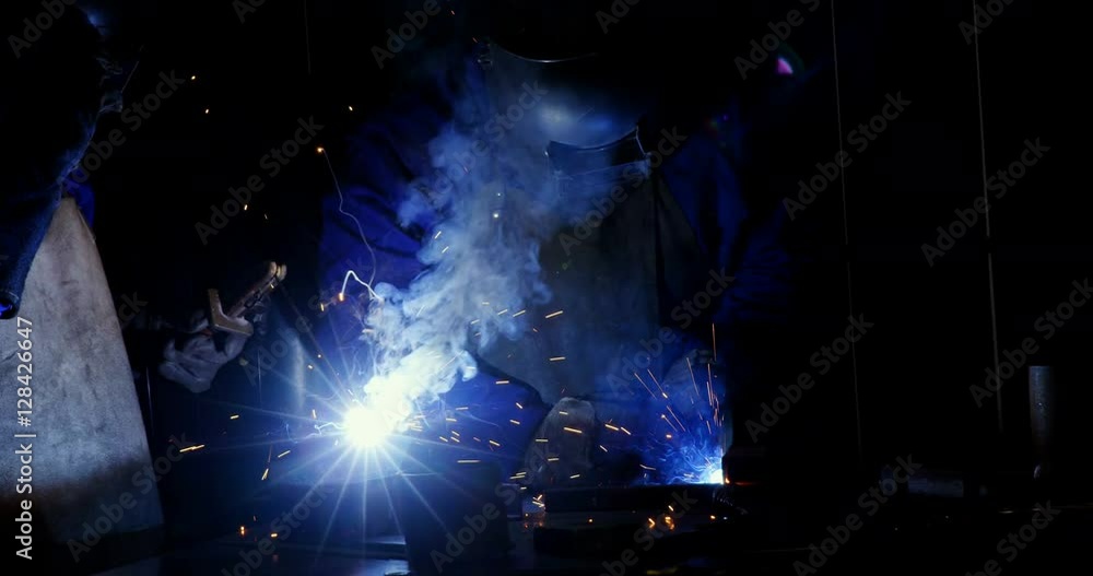 Welder welding a metal Welder welding a metal