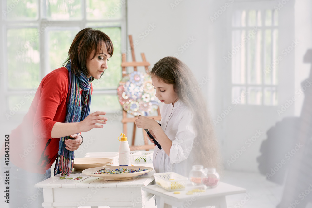 Woman and girl with colorful glass mosaic Woman and girl with colorful glass mosaic