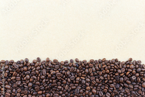 coffee beans on paper texture © memorystockphoto