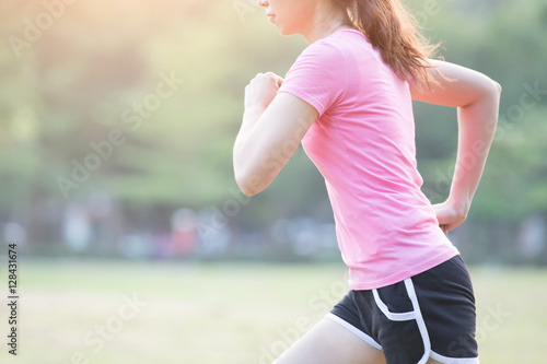 woman running with green background