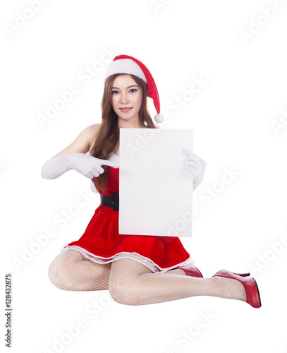 beautiful sexy woman wearing santa claus clothes with blank sign photo