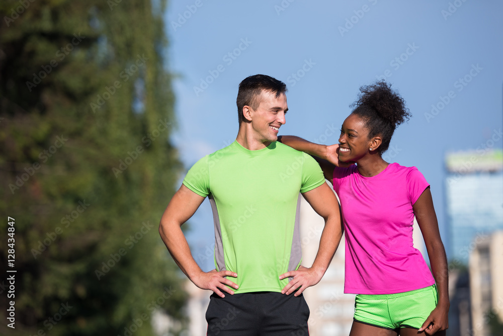 portrait of young multietnic jogging couple ready to run portrait of young multietnic jogging couple ready to run