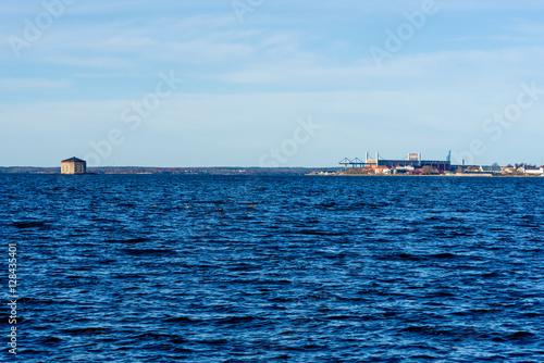 Part of the Swedish coastal heritage city of Karlskrona with the shipyard and the 19th century fortification lighthouse Godnatt (Good night).