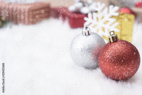 Christmas balls with gift box and snowflake on white background.