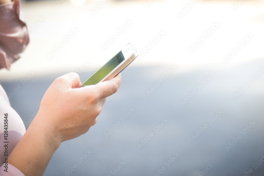Closeup of hand using smartphone Closeup of hand using smartphone