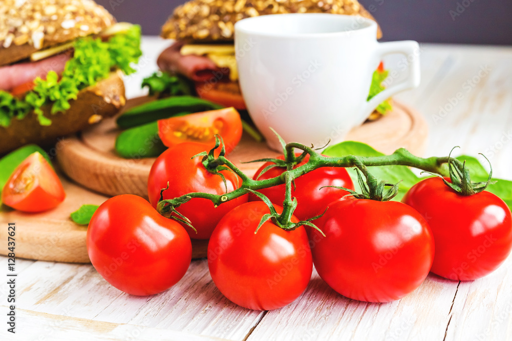 Burger sandwich with ham, cheese, tomatoes and lettuce Burger sandwich with ham, cheese, tomatoes and lettuce