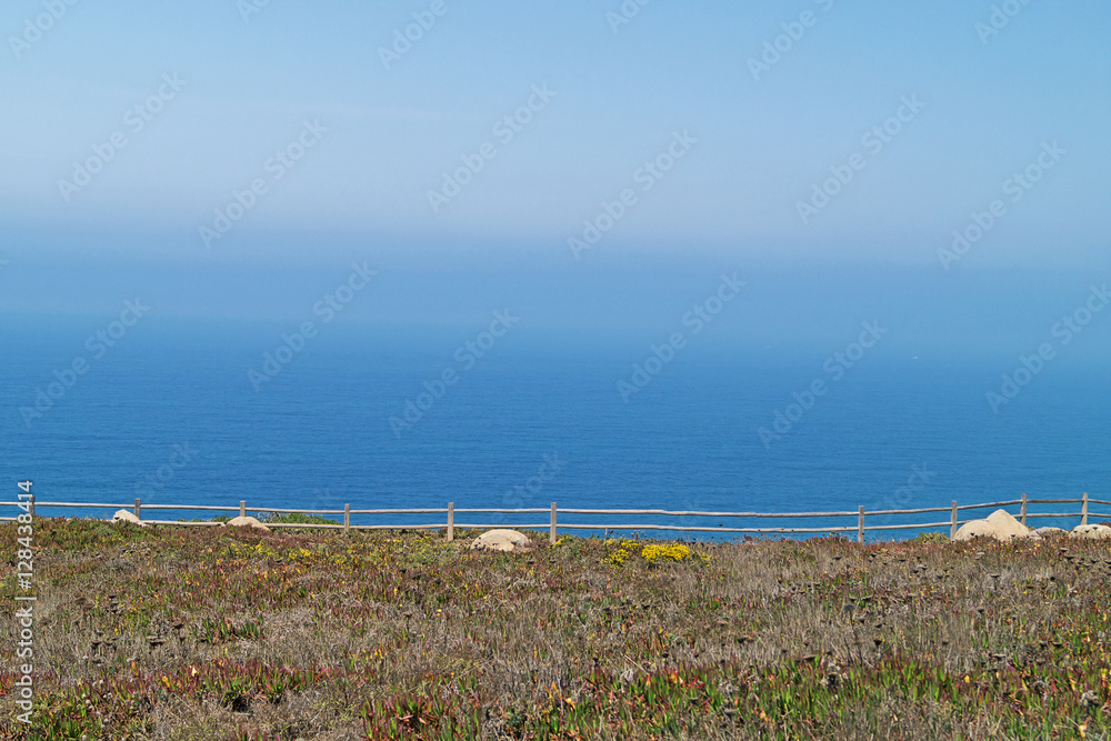 A view of the blue ocean fenced fence