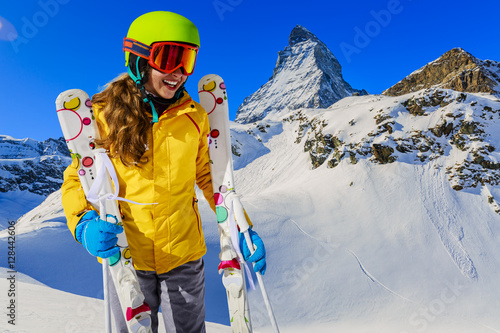 Teenage girl skiing in Swiss Alps in Sunny Day, Matterhorn in Ba