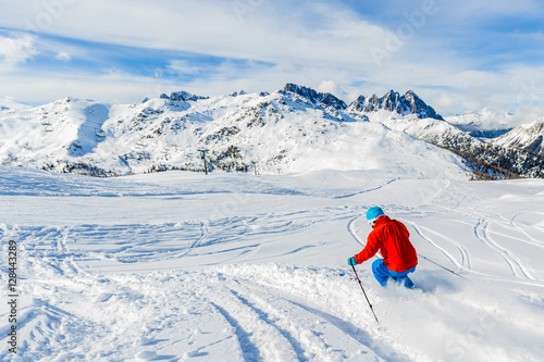 Skier skiing downhill in high mountains in fresh powder snow. Sa © Gorilla