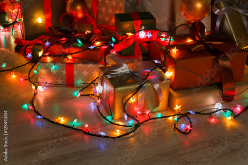 Christmas present and garland lights, holiday concept