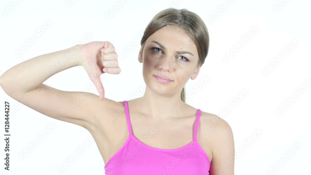 Thumbs Down By Beautiful Woman, White Background Thumbs Down By Beautiful Woman, White Background