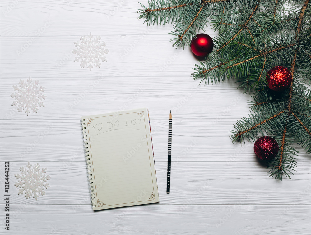 to do list among christmas presents on craft background to do list among christmas presents on craft background