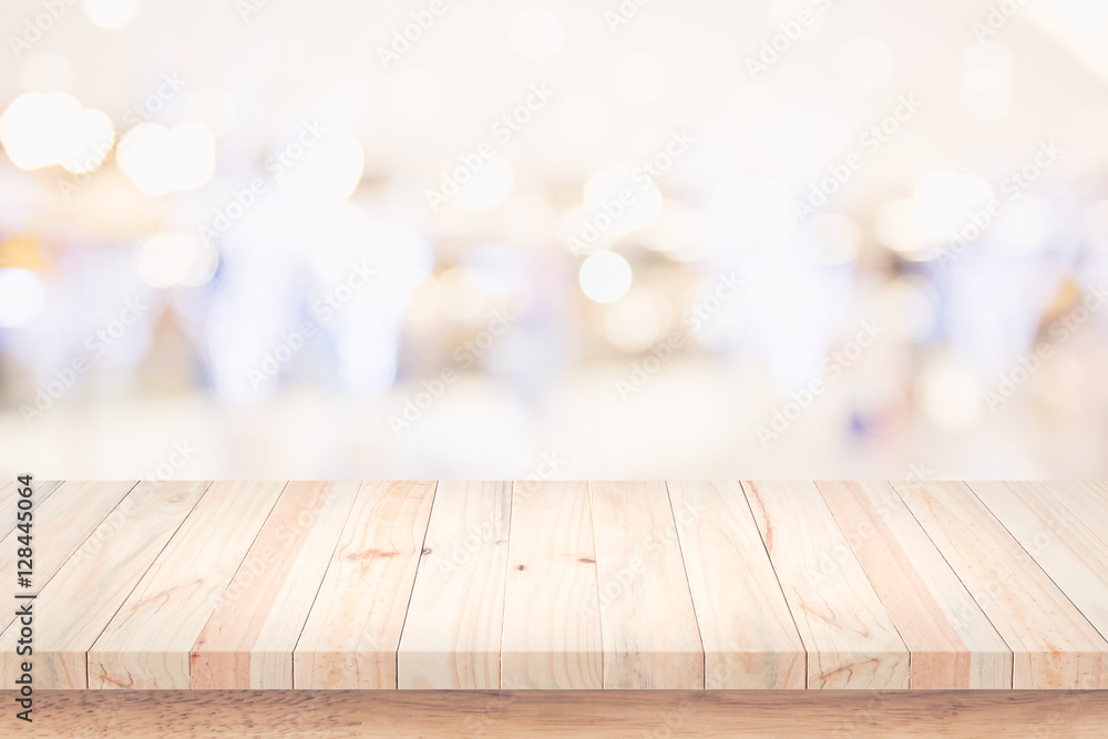 Empty top of wooden table with blur shopping mall background. Empty top of wooden table with blur shopping mall background.