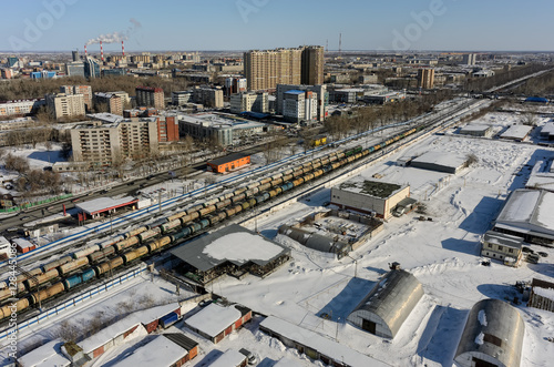 Tyumen, Russia - March 11, 2016: Railroad along 50 let VLKSM Street, dividing residential and industrial districts of city