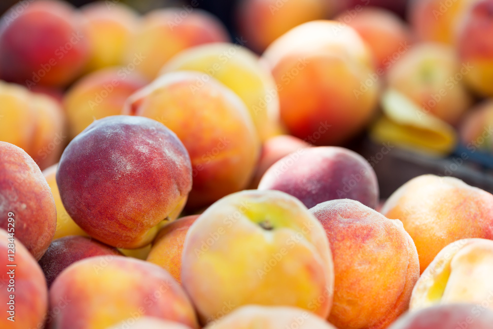 Fresh ripe organic peaches at market. Soft focus Fresh ripe organic peaches at market. Soft focus