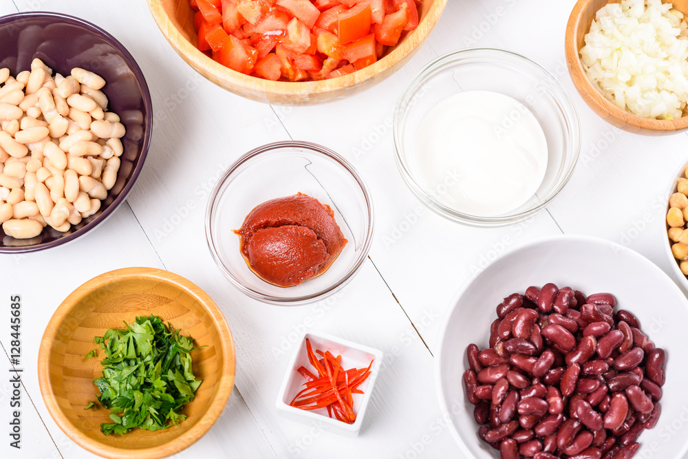 Fresh Food Ingredients On White Wood Kitchen Table Fresh Food Ingredients On White Wood Kitchen Table