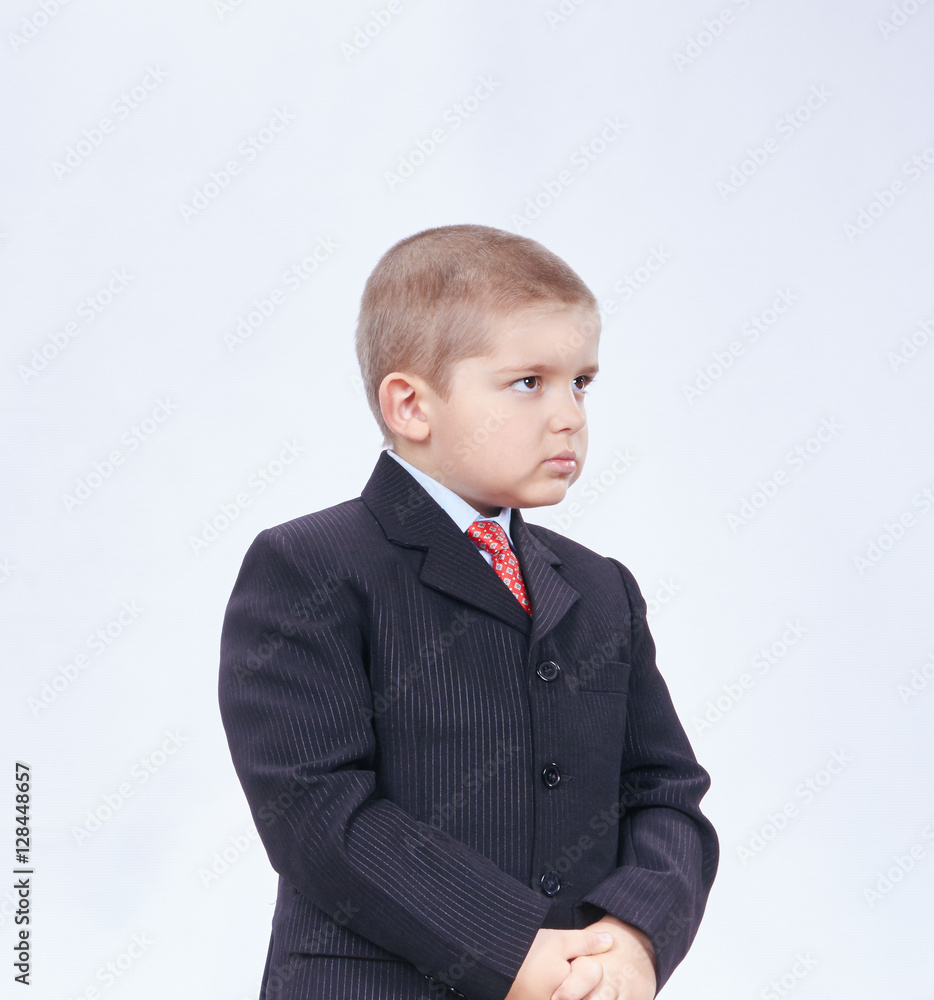 A little boy in a suit and tie A little boy in a suit and tie