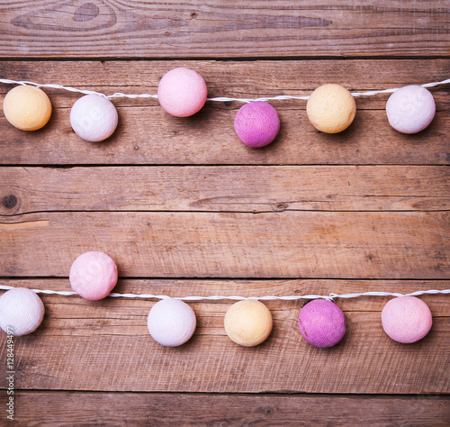 Cotton Christmas garland. Bright multi-colored decoration.