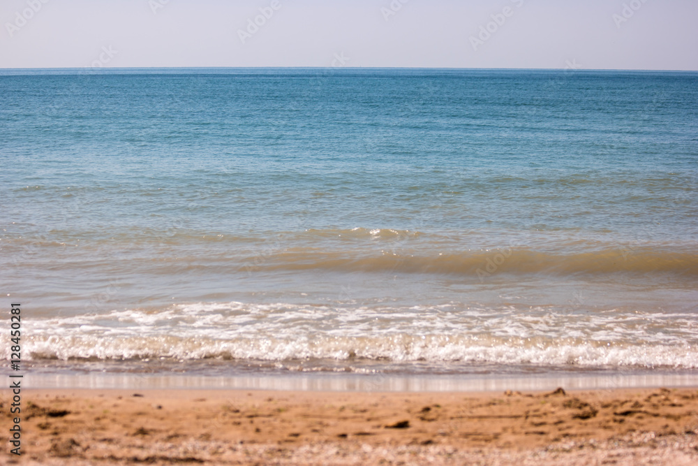 Sea and sand. Horizon with blue water. Great spot for summer rest. Small piece of paradise.
