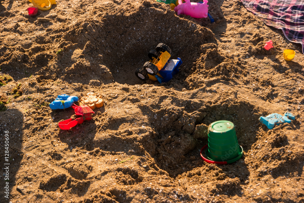 Toys on the beach. Toy truck and bucket. Build whatever you want. Imagine and create. Toys on the beach. Toy truck and bucket. Build whatever you want. Imagine and create.