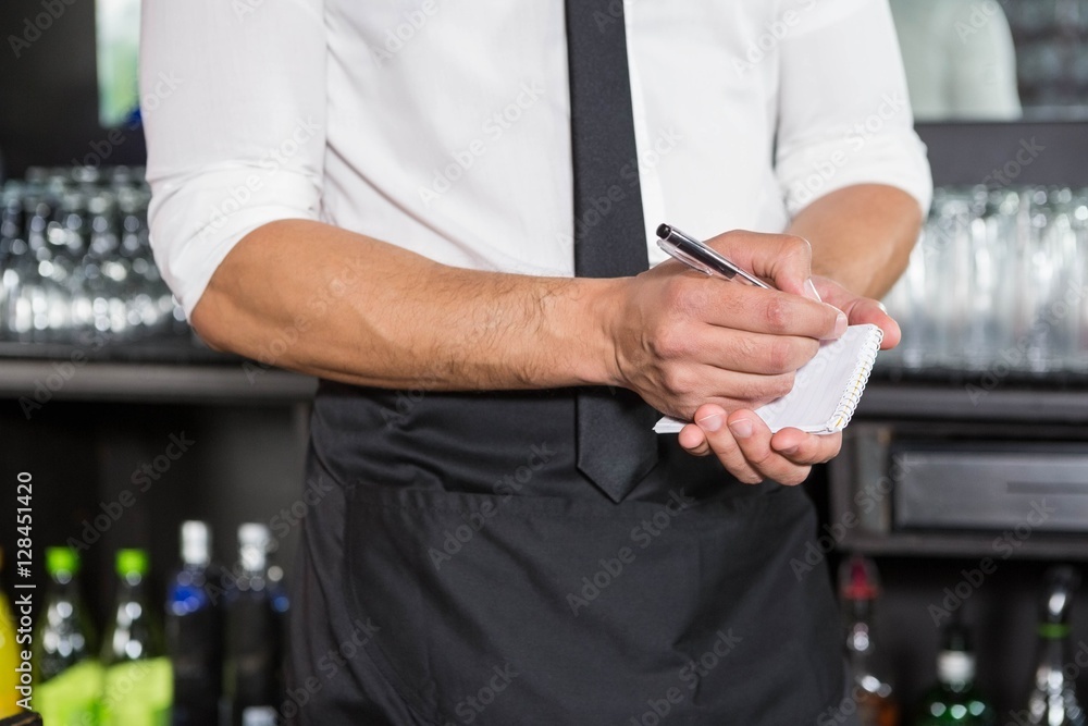 Waiter writing down an order Waiter writing down an order
