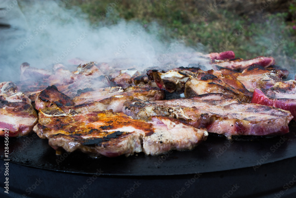 Grilling meat on wood stove Grilling meat on wood stove
