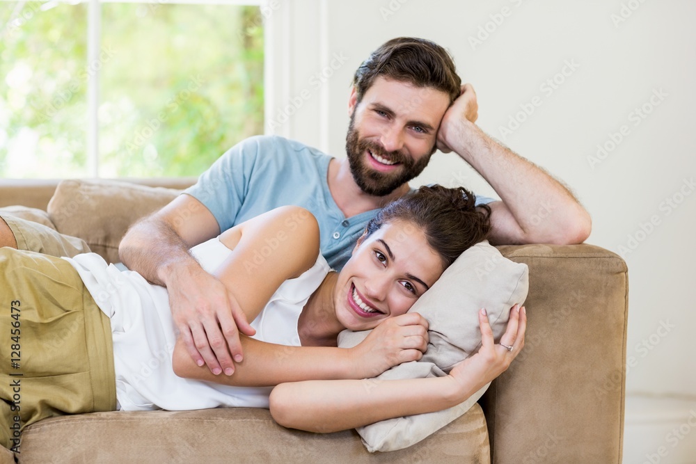 Portrait of young couple relaxing on sofa Portrait of young couple relaxing on sofa