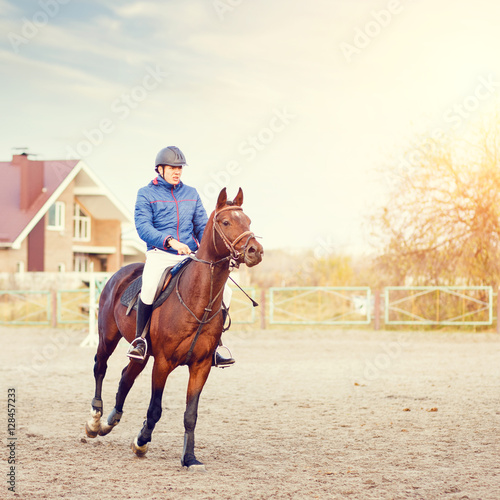 Sportsman riding horse on equestrian competition.