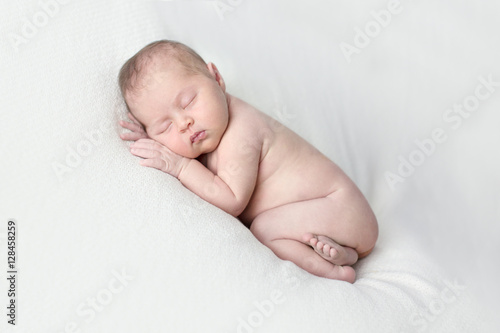 newborn sleeping on light background, real life,  lifestyle,