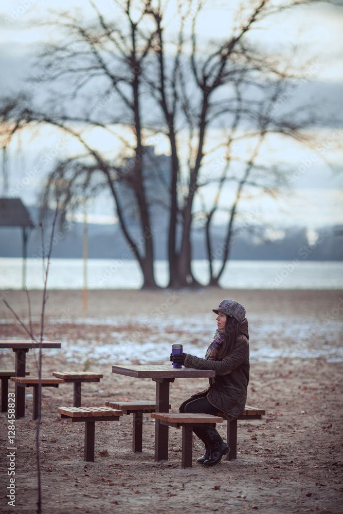 Woman Relaxing On Park Bench With Coffee Woman Relaxing On Park Bench With Coffee