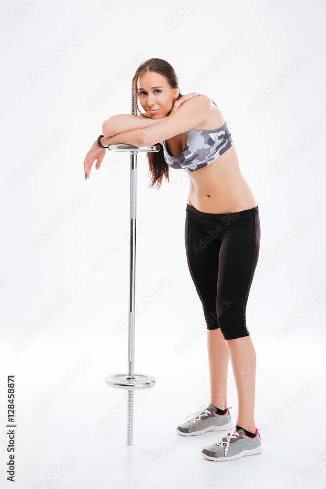 Full length pretty fitness girl with barbell Full length pretty fitness girl with barbell
