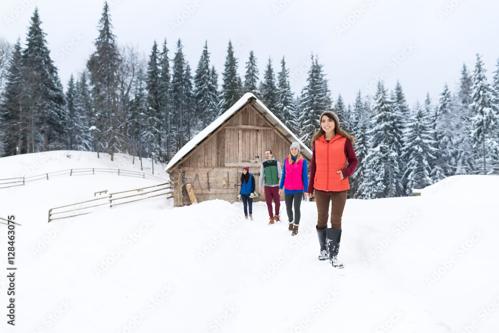 People Group Near Wooden Country House Winter Snow Resort Cottage Friends On Vacation