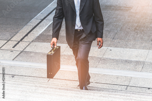 Businessman the stairs in a rush hour to work. © chayantorn