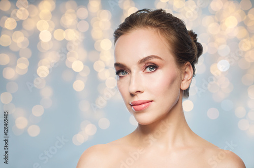 beautiful young woman face over white background