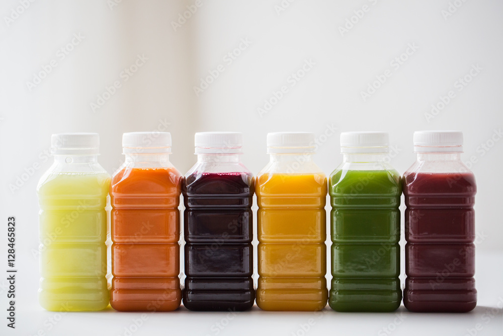 bottles with different fruit or vegetable juices bottles with different fruit or vegetable juices