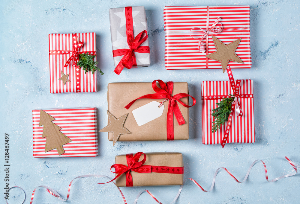 Fototapeta premium Christmas background with gift boxes and decorations, stone table, top view