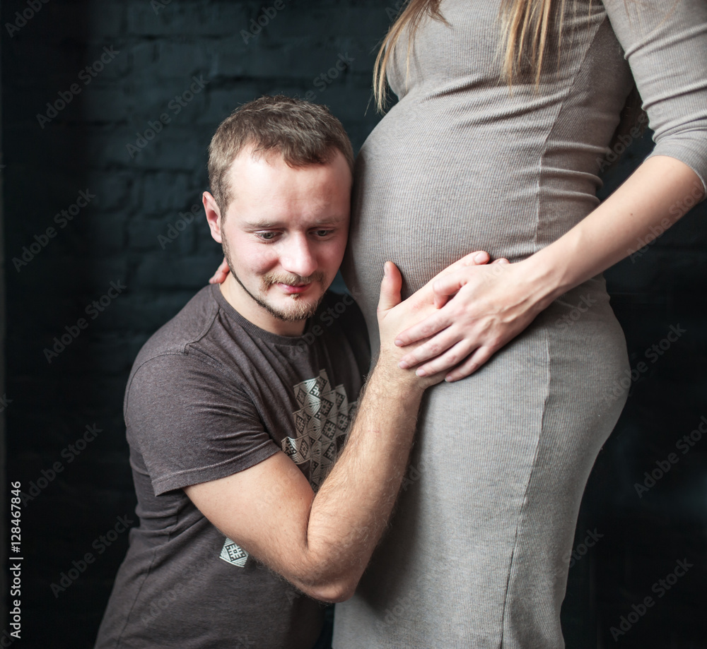 Young man and pregnant woman expecting a baby Young man and pregnant woman expecting a baby