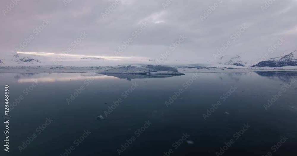 areal adventure shot, fly over glacier lagoon in large wide open landscape areal adventure shot, fly over glacier lagoon in large wide open landscape