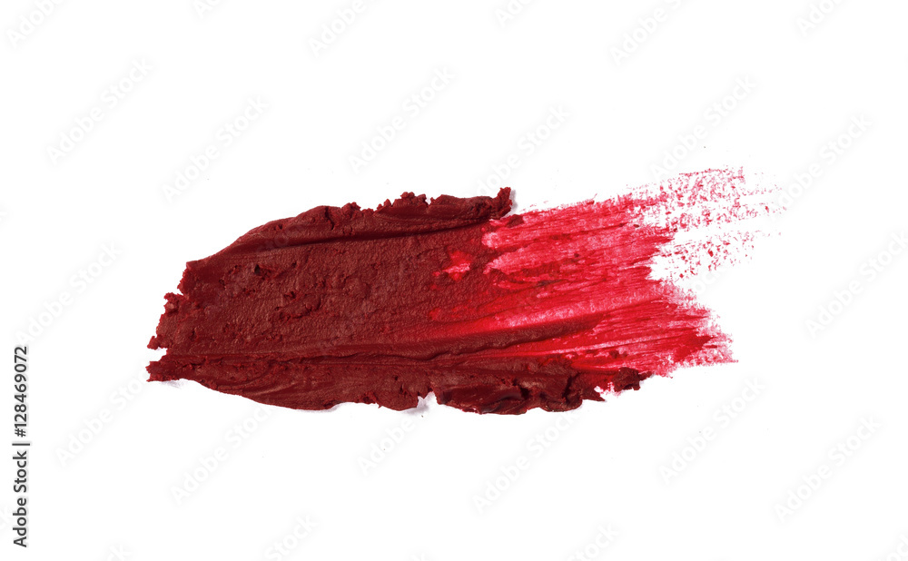 Fototapeta premium Smudged red color lipstick on background