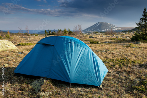 Camping tent near high moutain in the evening sunset time  Ural  Russia