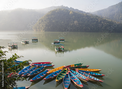 Colour boats on Phewa lake. Pokhara, Nepal photo