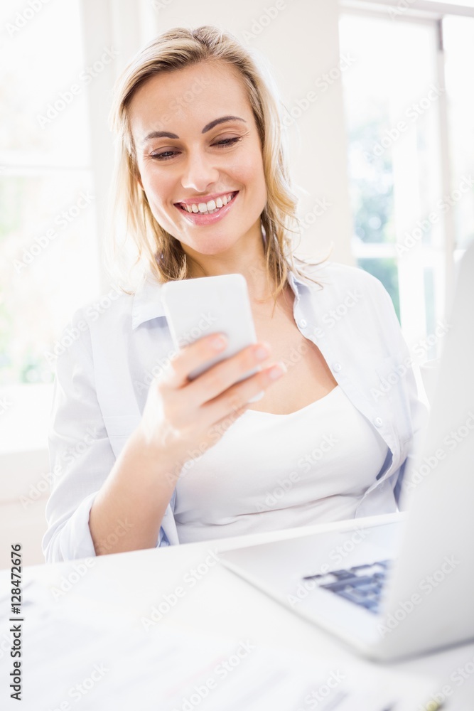 Woman text messaging on mobile phone Woman text messaging on mobile phone