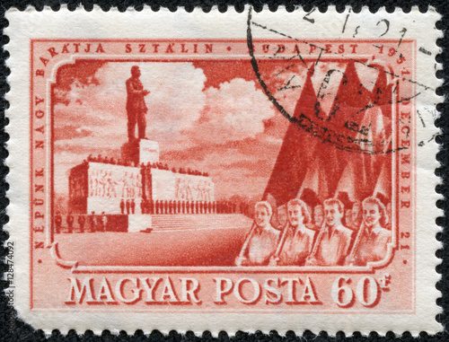 Stamp printed in Hungary shows May Day demonstration in Budapest against the backdrop of the monument to Joseph Stalin