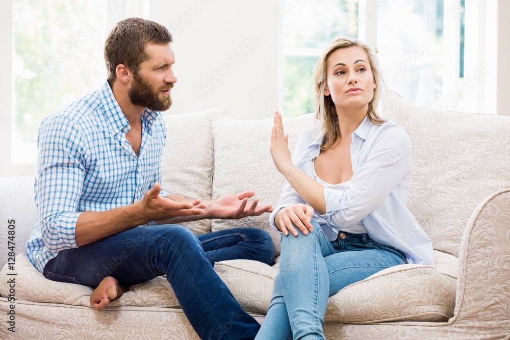 Upset couple arguing with each other Upset couple arguing with each other